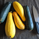 Pictured: far too many too-large squashes and a knife that has its work cut out for it.